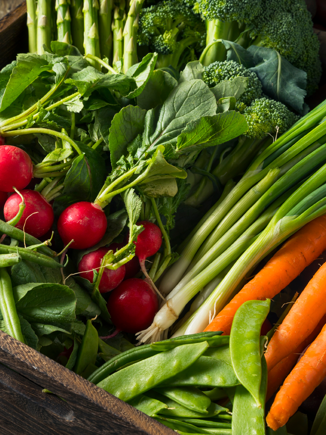 Wooden box full of Farmers' Market fresh vegetables